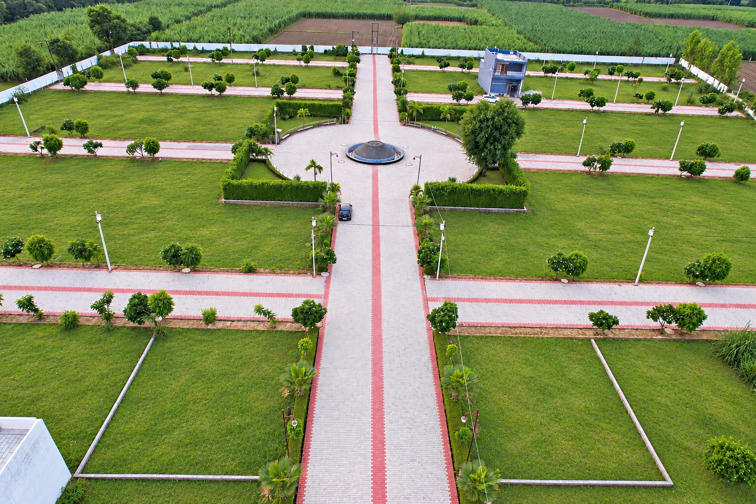 Aerial view of the township fountain, roads and landscaped plots